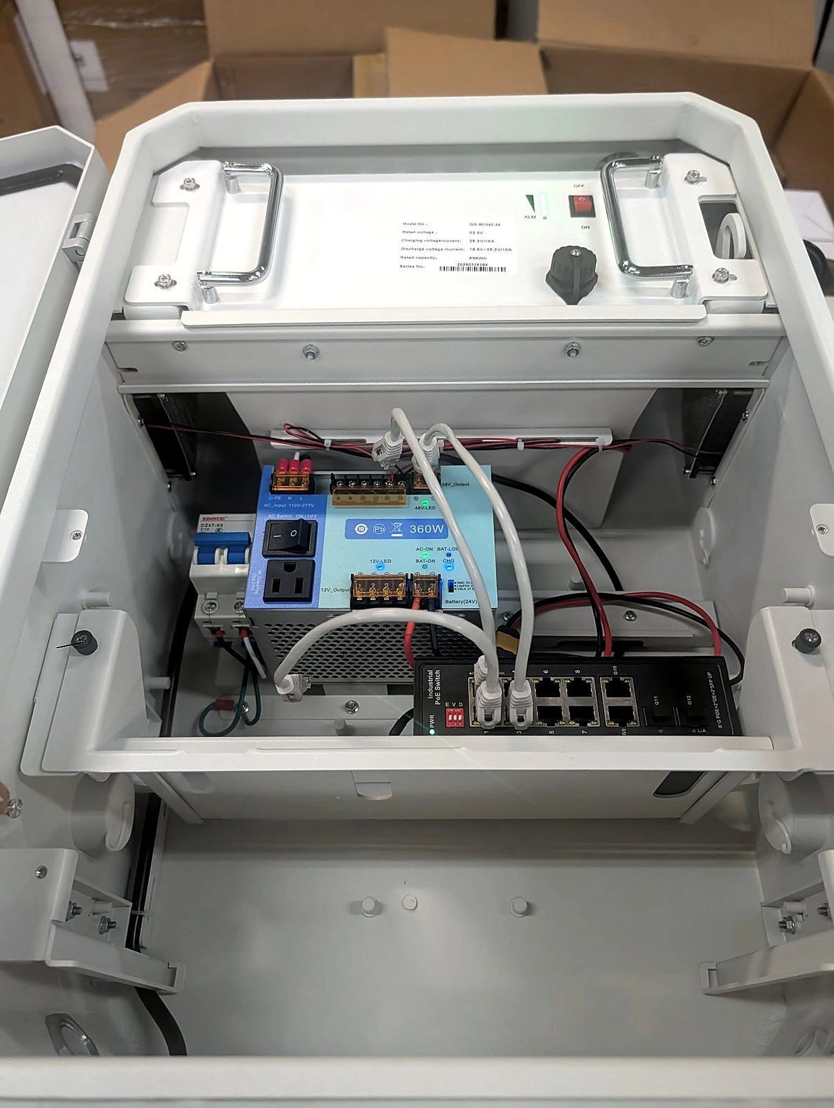 Pole-mounted camera with battery and PoE enclosure